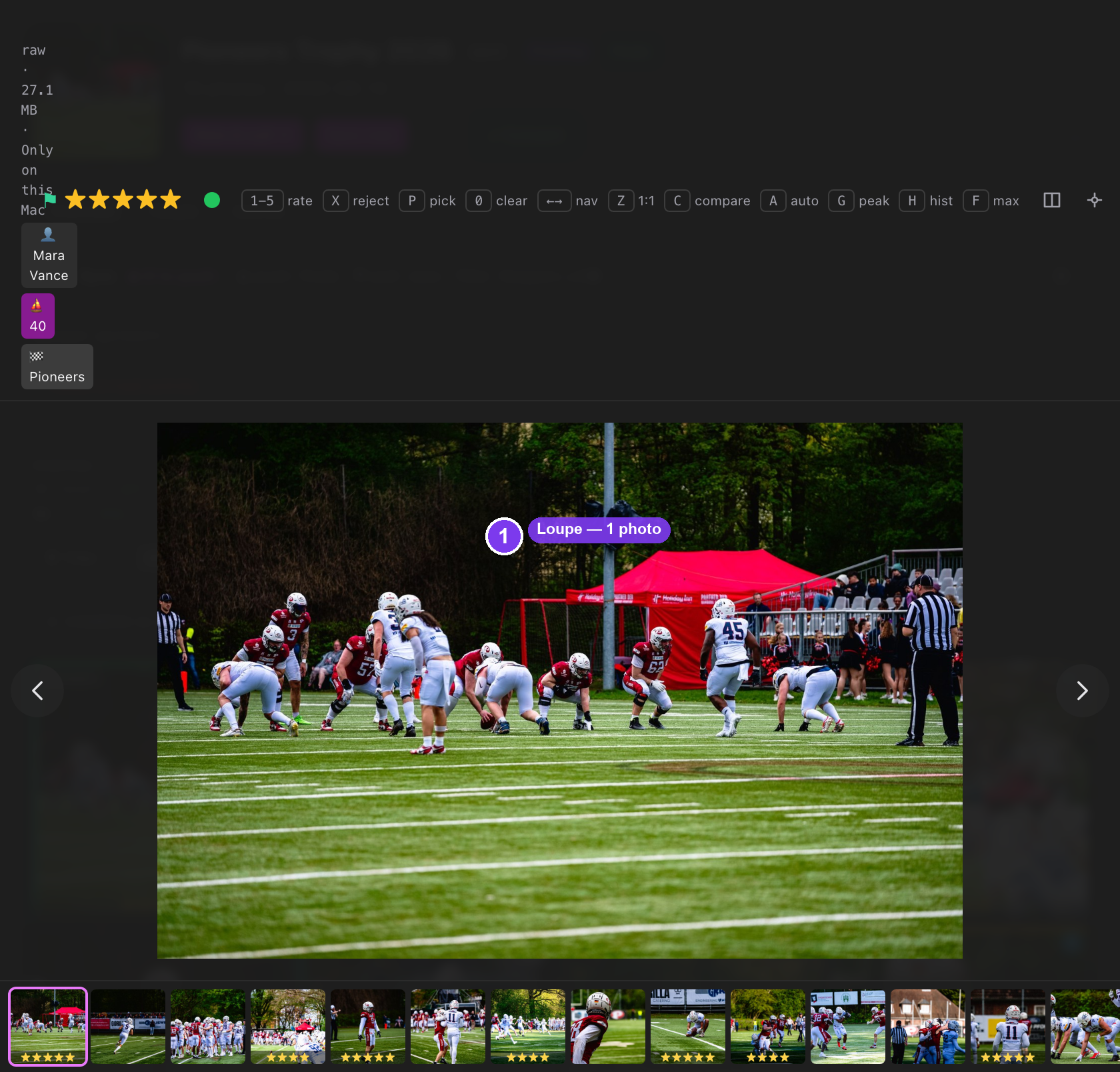 The desktop loupe showing one photo full-size, with the keyboard cheat-sheet, top toggle buttons, bottom rate bar and right metadata panel